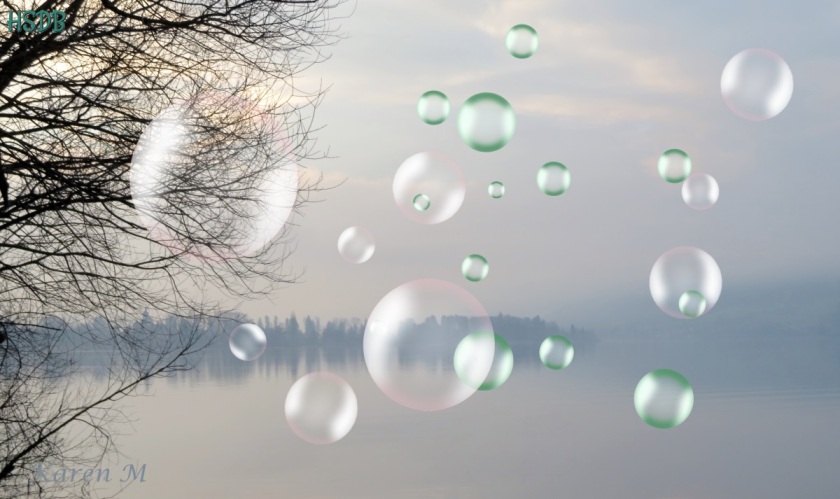 a grey misty lake scene with distant trees reflected in the water. Bubbles have been added to the picture